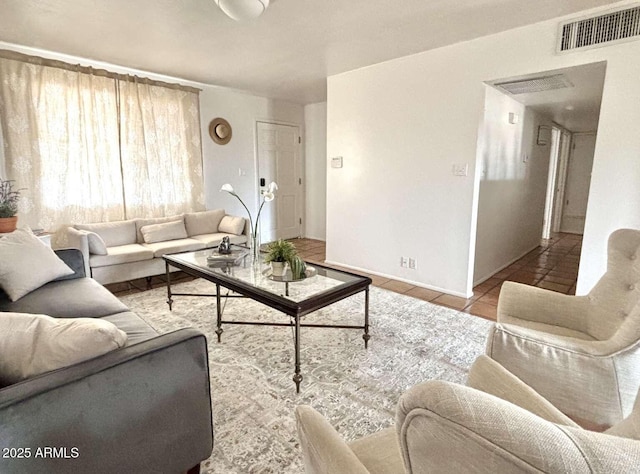 tiled living area featuring visible vents