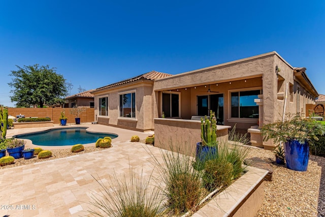27537 W Yukon Dr, Buckeye, AZ 85396 - back of house featuring a patio area, a fenced backyard, stucco siding, and a tile roof