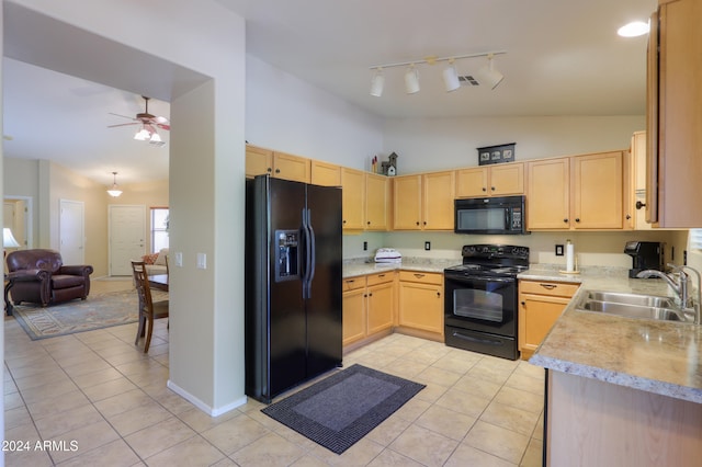 kitchen featuring light brown cabinetry, ceiling fan, sink, black appliances, and light tile patterned floors