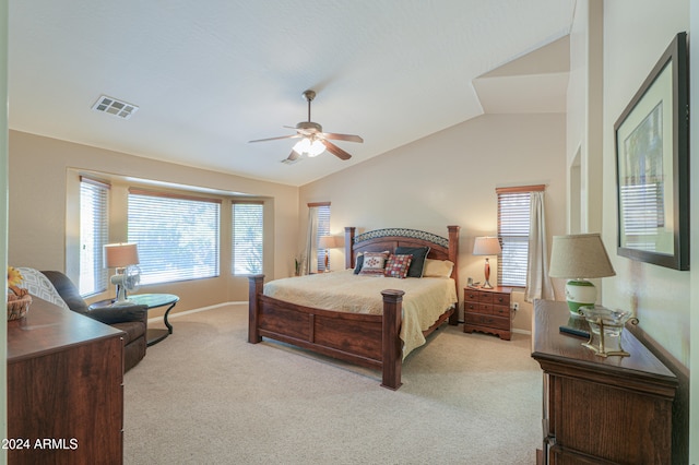 carpeted bedroom featuring vaulted ceiling and ceiling fan