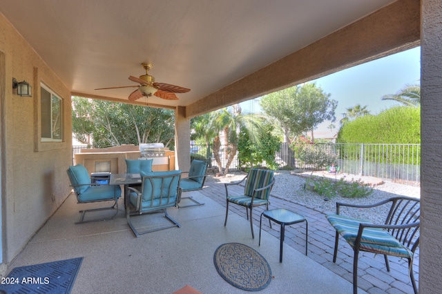 view of patio featuring ceiling fan