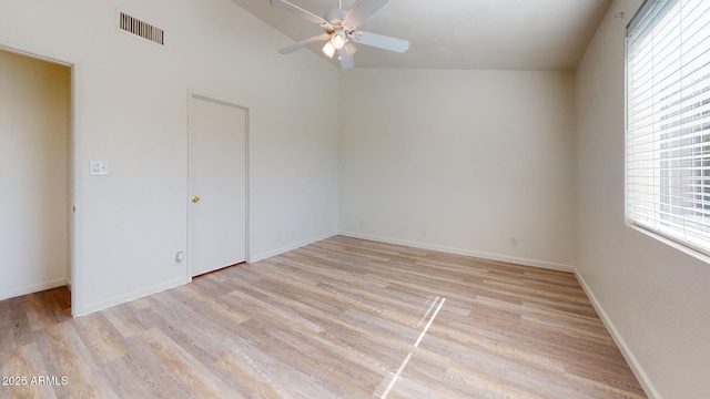 12445 N 21st Ave Unit 4, Phoenix, AZ 85029 - unfurnished bedroom featuring light wood-style flooring, baseboards, a ceiling fan, and vaulted ceiling