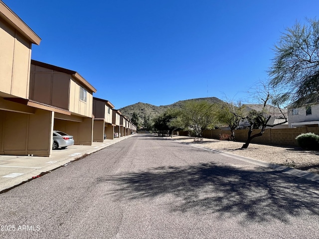 12445 N 21st Ave Unit 4, Phoenix, AZ 85029 - view of asphalt street featuring a mountain view, curbs, and a residential view