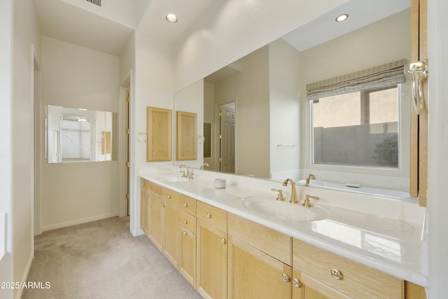 bathroom with vanity and a tub to relax in