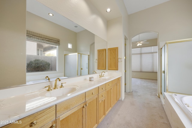 bathroom with vanity, plus walk in shower, and ceiling fan