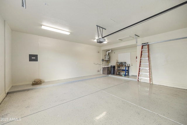 garage featuring a garage door opener, electric panel, and water heater