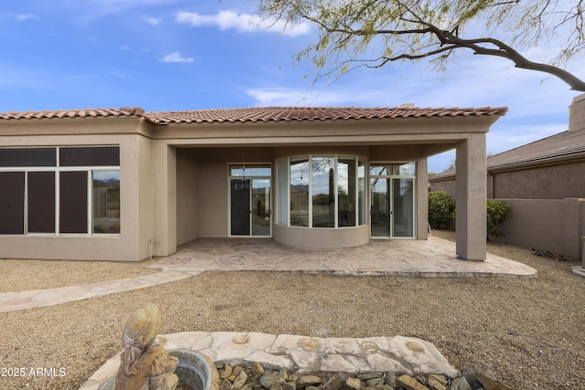 rear view of house featuring a patio