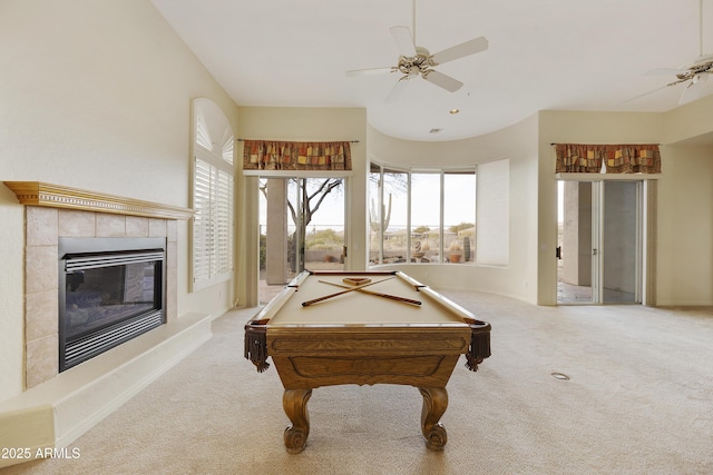 playroom featuring light carpet, a tiled fireplace, billiards, and ceiling fan