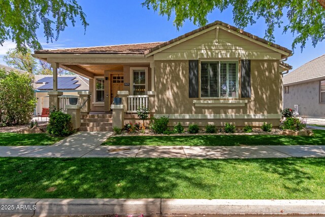 2634 E Tamarisk St, Gilbert, AZ 85296 - view of front of property with a tile roof, covered porch, and a front yard