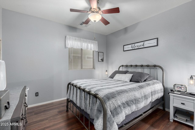 bedroom with ceiling fan and dark hardwood / wood-style flooring