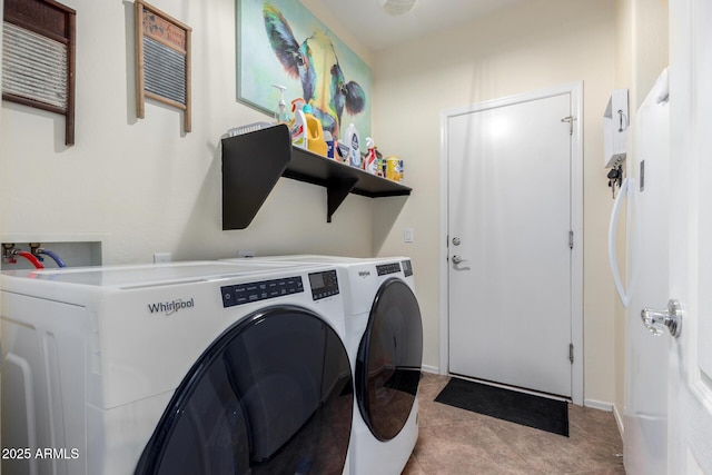 clothes washing area featuring light tile patterned flooring and washing machine and dryer