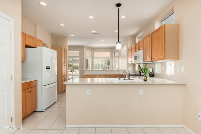 14608 W Via Montoya, Sun City West, AZ 85375 - kitchen with white appliances, a peninsula, a sink, light countertops, and recessed lighting