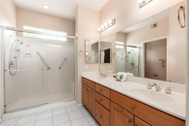 14608 W Via Montoya, Sun City West, AZ 85375 - full bathroom featuring a shower stall, double vanity, and tile patterned flooring