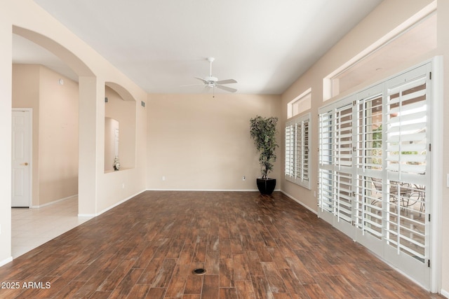 14608 W Via Montoya, Sun City West, AZ 85375 - spare room with ceiling fan, wood finished floors, baseboards, and arched walkways
