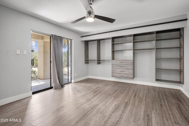 9340 N 92nd St Unit 118, Scottsdale, AZ 85258 - unfurnished bedroom with baseboards and wood finished floors
