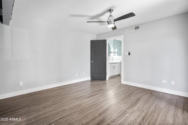 9340 N 92nd St Unit 118, Scottsdale, AZ 85258 - empty room with visible vents, wood finished floors, baseboards, and ceiling fan