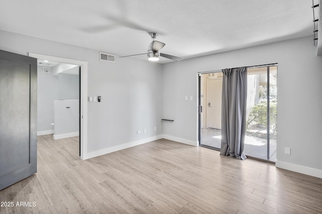 9340 N 92nd St Unit 118, Scottsdale, AZ 85258 - unfurnished room with a ceiling fan, light wood-style floors, visible vents, and baseboards