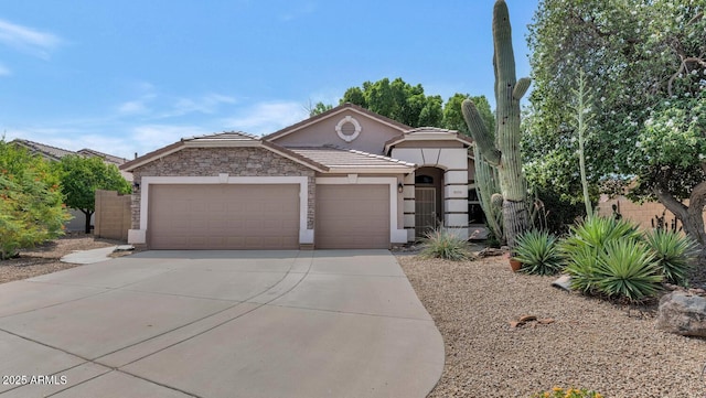 5733 E Jaeger St, Mesa, AZ 85205 - view of front facade featuring an attached garage, driveway, stucco siding, and a tile roof
