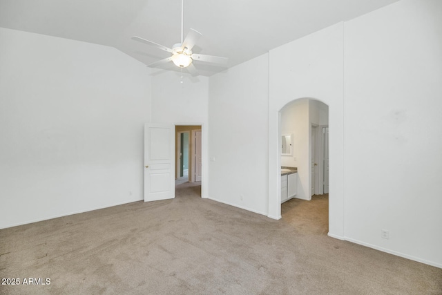 5733 E Jaeger St, Mesa, AZ 85205 - unfurnished room featuring arched walkways, light colored carpet, vaulted ceiling, and a ceiling fan
