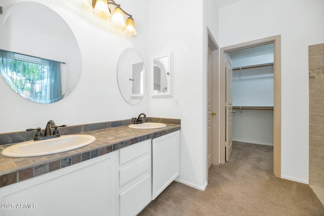 5733 E Jaeger St, Mesa, AZ 85205 - bathroom with double vanity and a walk in closet