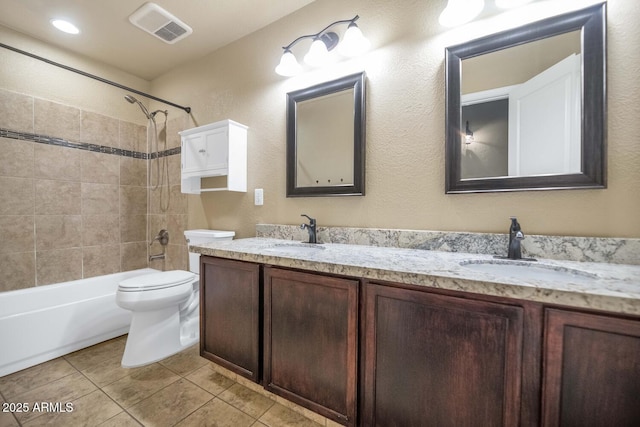 5733 E Jaeger St, Mesa, AZ 85205 - bathroom with double vanity,  shower combination, tile patterned floors, and a textured wall