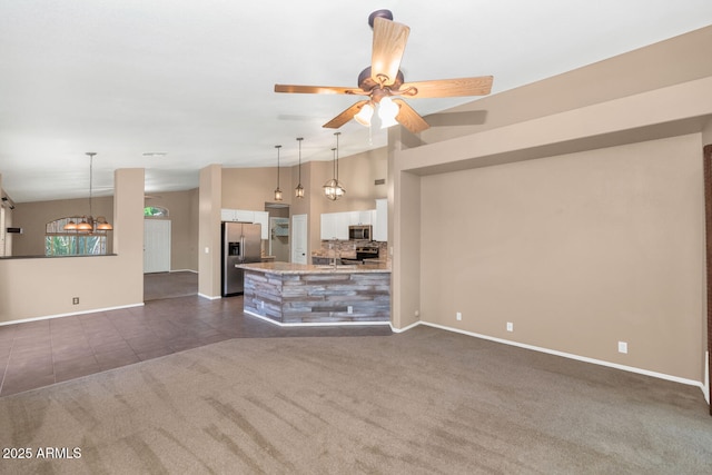 5733 E Jaeger St, Mesa, AZ 85205 - unfurnished living room featuring dark carpet, dark tile patterned floors, lofted ceiling, ceiling fan, and a chandelier