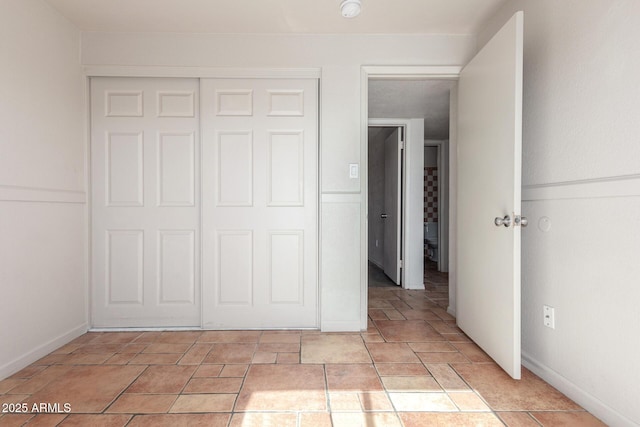 unfurnished bedroom with a closet