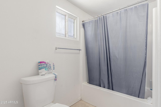 bathroom featuring toilet and shower / bath combo