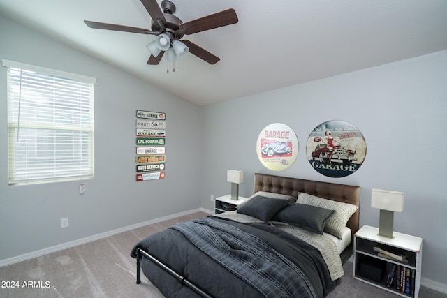 bedroom featuring ceiling fan, carpet floors, and vaulted ceiling