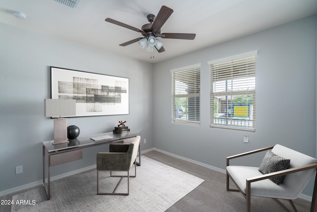 carpeted office with ceiling fan