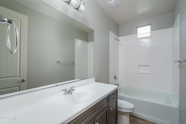 full bathroom featuring shower / tub combination, vanity, toilet, and hardwood / wood-style floors