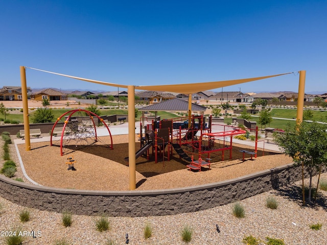 communal playground featuring a residential view