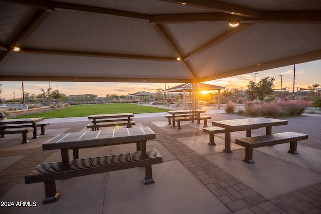 view of property's community with a lawn, a gazebo, and a patio area