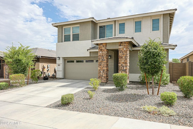 18813 W Solano Dr, Litchfield Park, AZ 85340 - view of front of property with stucco siding, an attached garage, and driveway