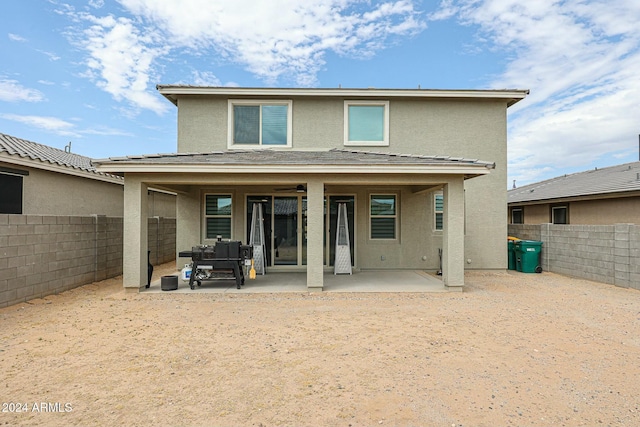 18813 W Solano Dr, Litchfield Park, AZ 85340 - rear view of property featuring stucco siding, a patio, and a fenced backyard