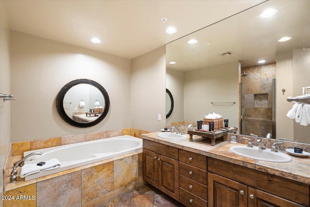 bathroom featuring vanity and plus walk in shower