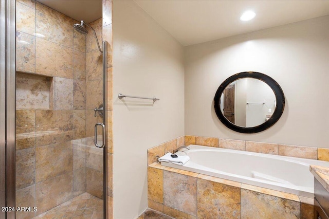 bathroom with vanity and separate shower and tub