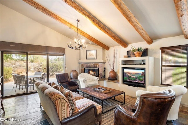 living room featuring beam ceiling, a notable chandelier, a fireplace, and high vaulted ceiling