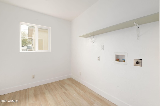 clothes washing area with baseboards, light wood finished floors, laundry area, electric dryer hookup, and washer hookup