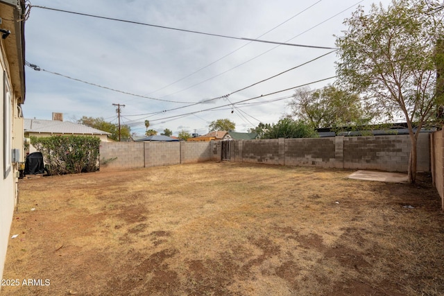 view of yard with a fenced backyard