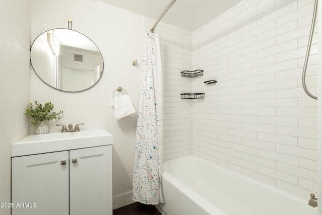 bathroom featuring visible vents, vanity, and shower / bath combination with curtain