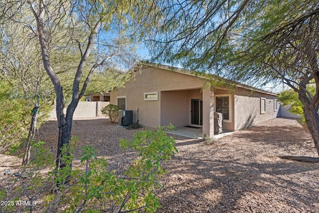 back of house featuring a patio area and central AC unit