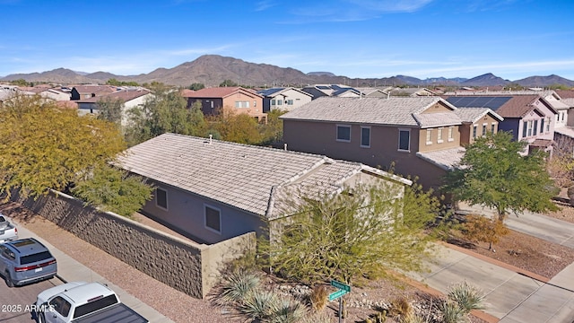 birds eye view of property with a mountain view