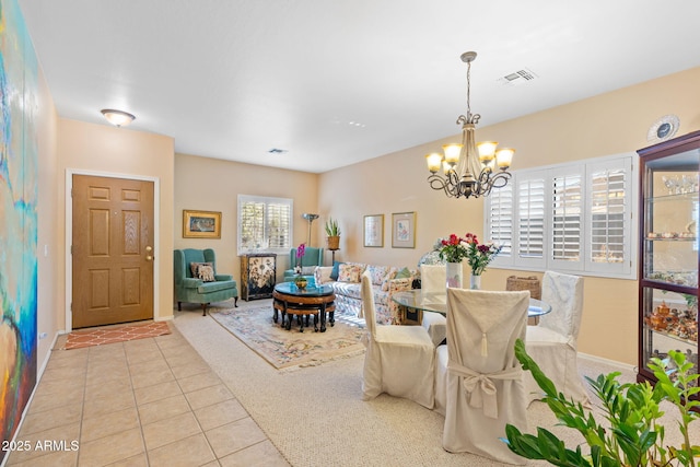 tiled dining area featuring a notable chandelier