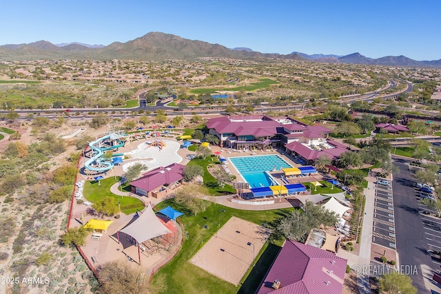 birds eye view of property featuring a mountain view