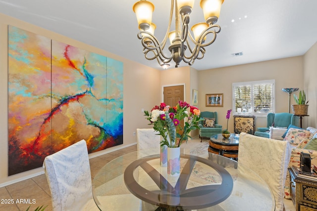 dining space with light tile patterned floors and a chandelier