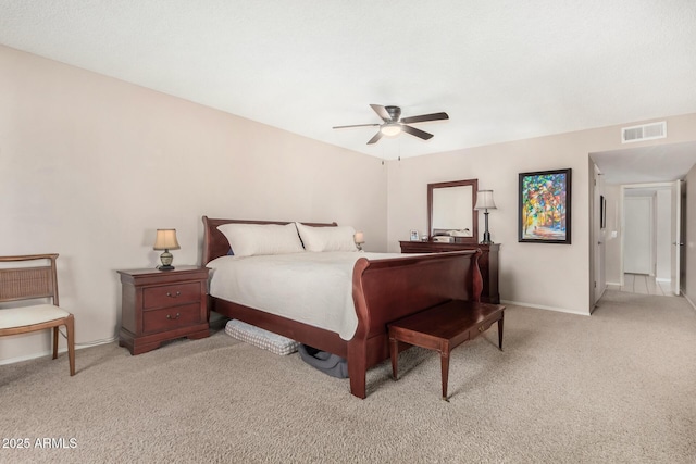 bedroom with baseboards, visible vents, ceiling fan, and light colored carpet