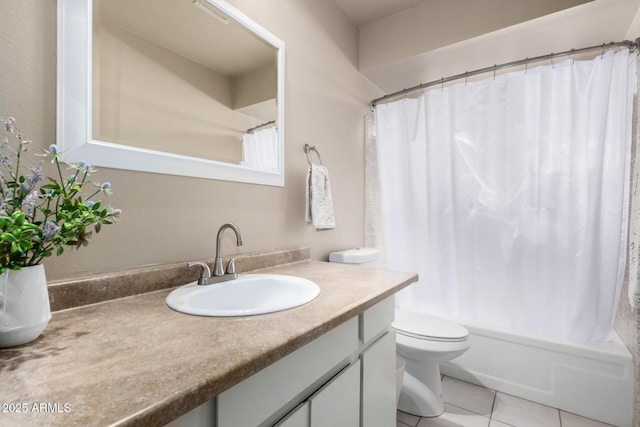 bathroom with shower / bathtub combination with curtain, vanity, toilet, and tile patterned floors