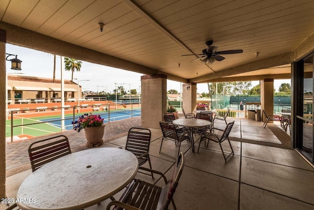 view of patio / terrace with a ceiling fan and outdoor dining space