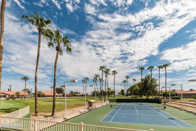 view of tennis court with fence